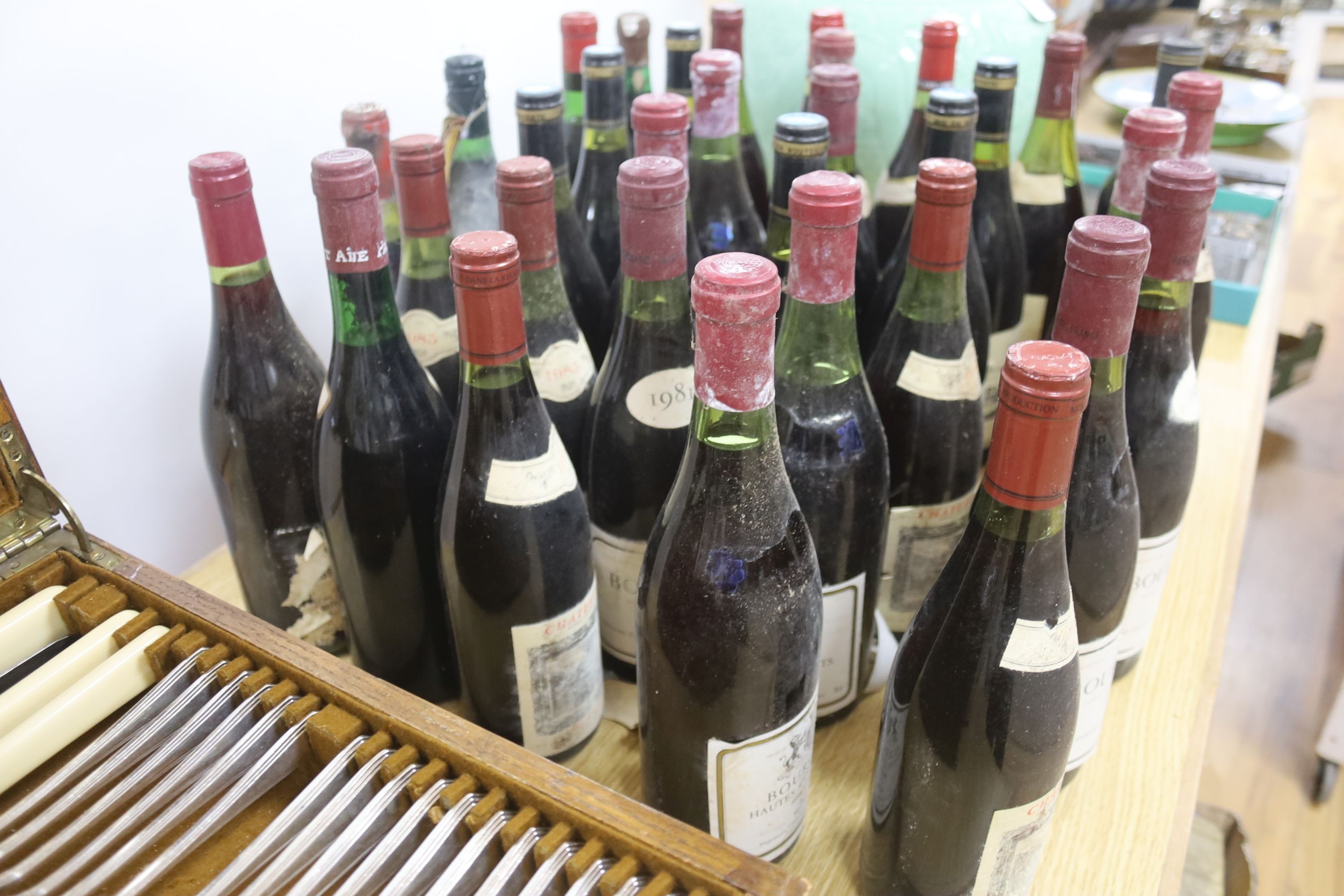 A quantity of mixed French Burgundy and Bordeaux and other red wines from 1969 and later, 33 in total, including one Château Cissac Cru Bourgeois 1969
